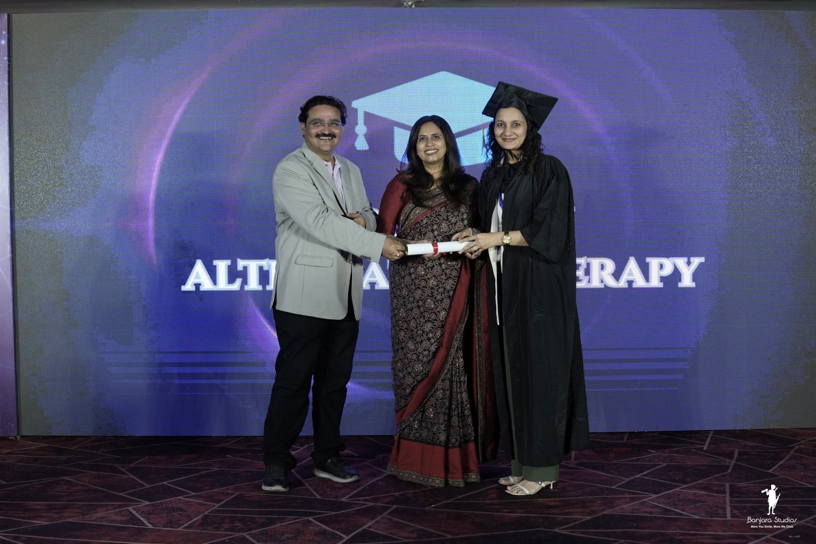 Receiving the certificate on stage.