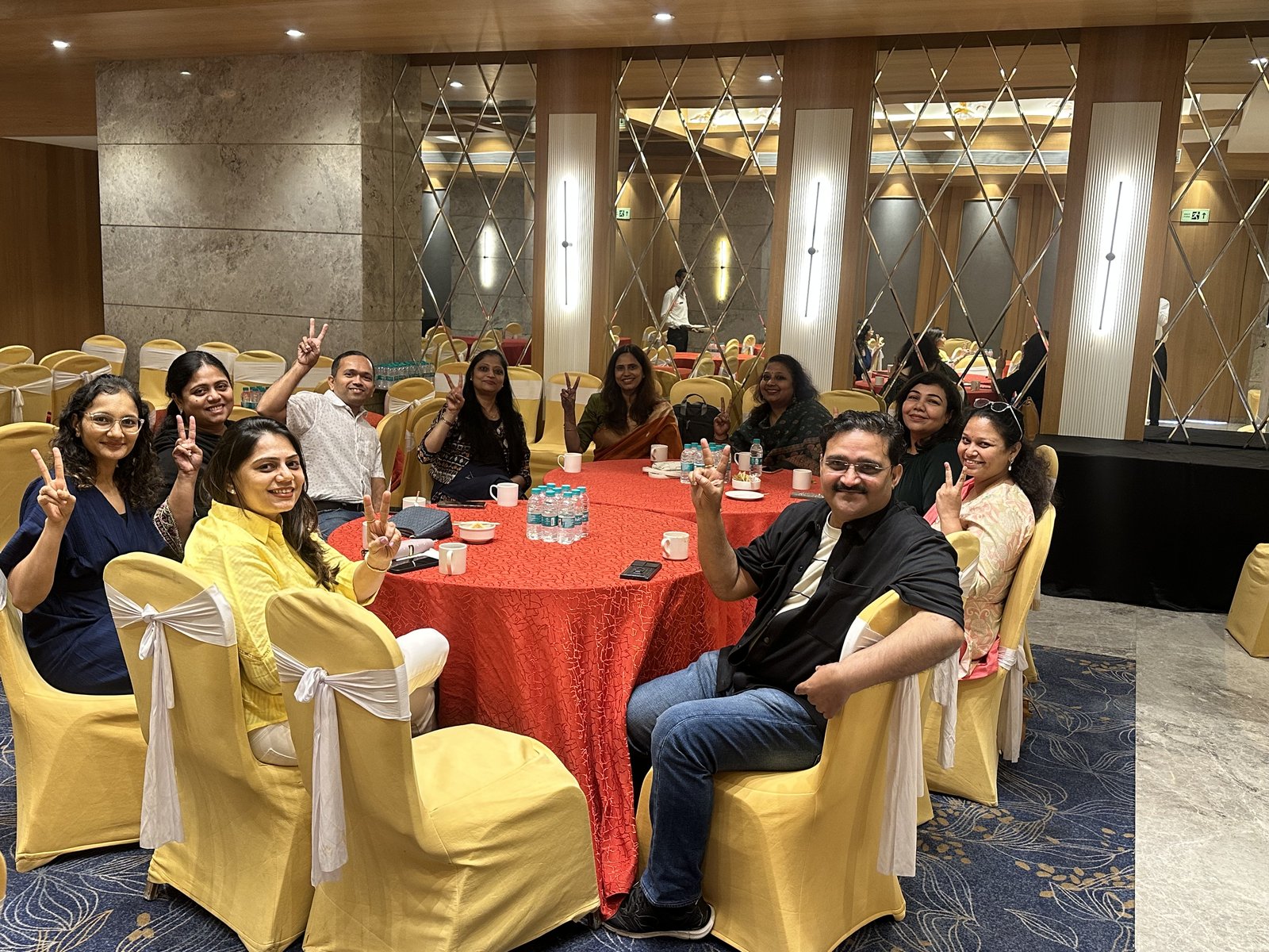 Between sessions, around the table.