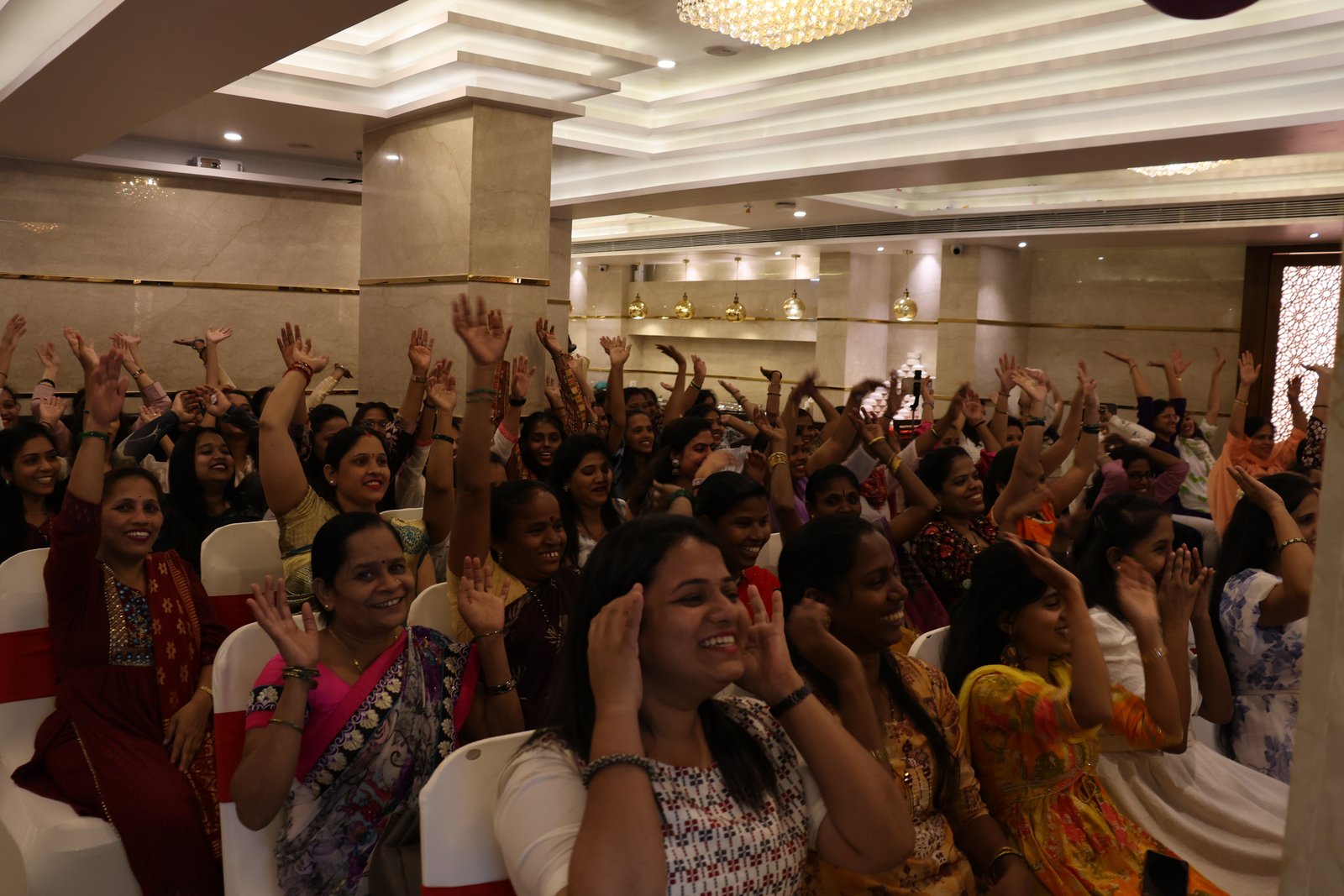 Hands up across the hall.